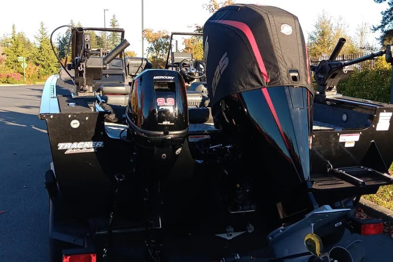 Slide: The Image of 2024 Tracker Targa V-19 WT Tournament Edition boat with Mercury outboard motor. - 2