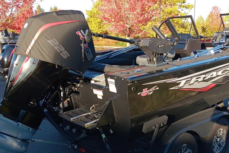 Slide: The Image of 2024 Tracker Targa V-19 WT Tournament Edition boat with powerful engine, parked outdoors. - 8