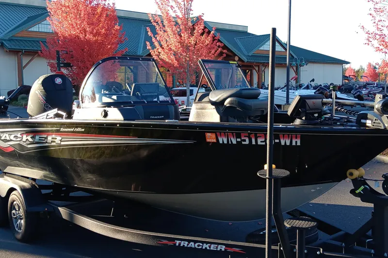 Slide: The Image of 2024 Tracker Targa V-19 WT Tournament Edition boat on trailer, autumn backdrop. - 9