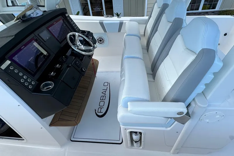 Slide: The Image of 2025 Robalo R360 Center Console interior with modern helm and seating. - 22