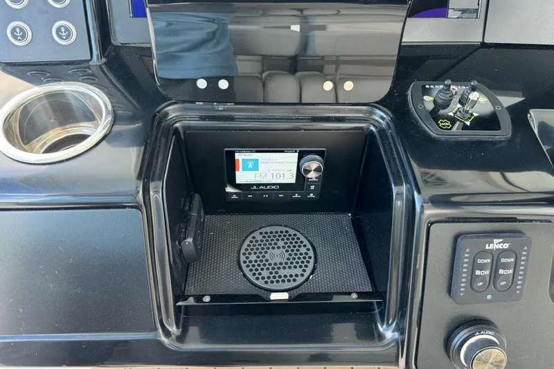 Slide: The Image of 2025 Robalo R360 Center Console dashboard with JL Audio system and control panel. - 25