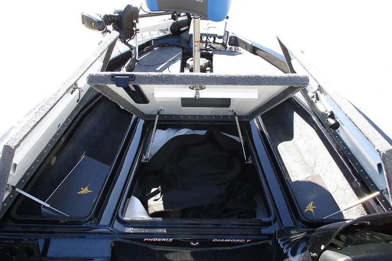 Slide: The Image of 2026 Phoenix 818 Pro boat interior with open storage compartments and seating. - 11