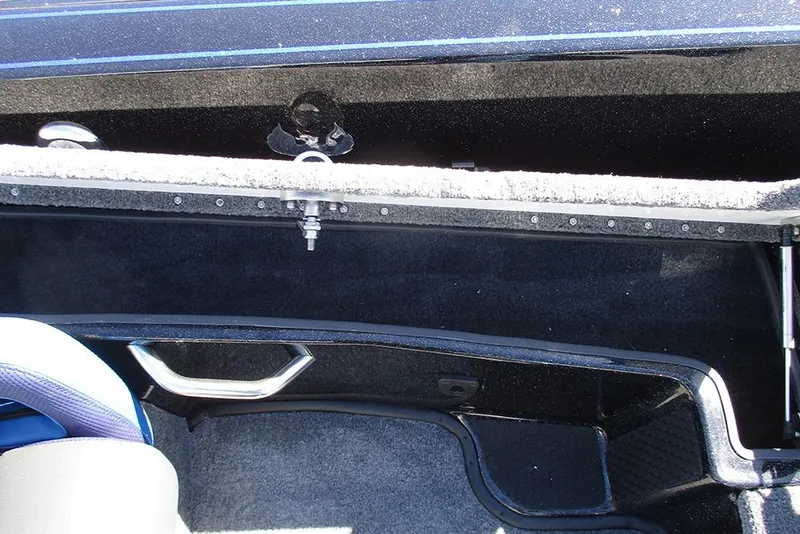 Slide: The Image of Interior view of 2026 Phoenix 818 Pro boat storage compartment with carpeted finish. - 23