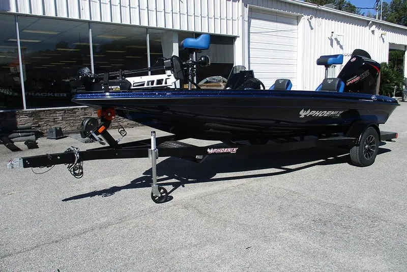 Slide: The Image of 2026 Phoenix 818 Pro boat on trailer outside dealership. - 3
