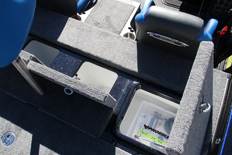 Slide: The Image of 2026 Phoenix 818 Pro boat interior with open storage compartments and seating. - 30