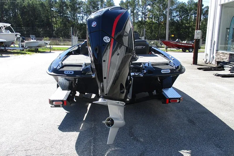 Slide: The Image of 2026 Phoenix 818 Pro boat with powerful outboard motor, parked outdoors. - 8