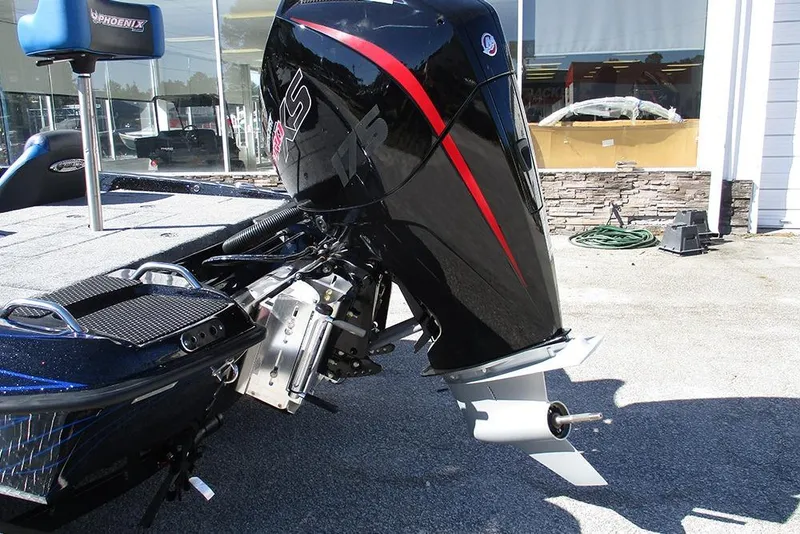 Slide: The Image of 2026 Phoenix 818 Pro boat with powerful outboard motor in a showroom setting. - 9