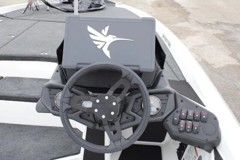 Slide: The Image of 2026 Skeeter ZXE21 boat dashboard with steering wheel and control panel. - 12