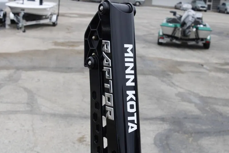 Slide: The Image of Minn Kota Raptor anchor on 2026 Skeeter ZXE21 boat, parking lot background. - 13