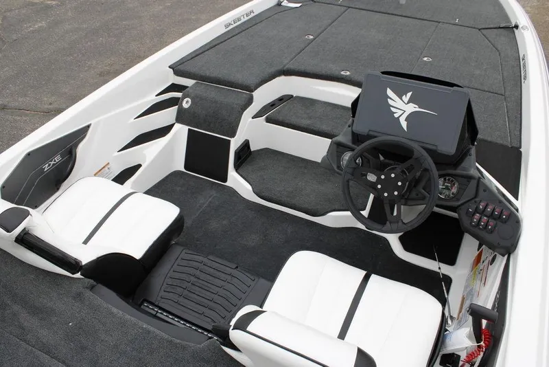 Slide: The Image of 2026 Skeeter ZXE21 boat interior with modern dashboard and seating. - 18