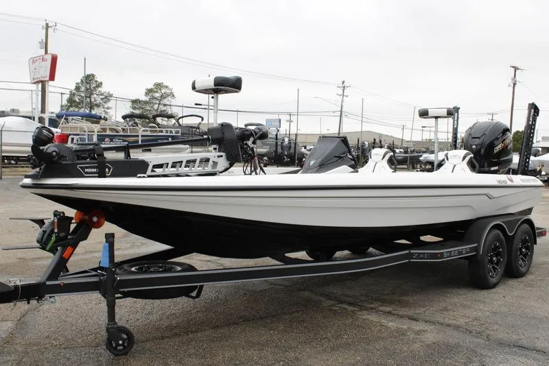 Slide: The Image of 2026 Skeeter ZXE21 bass boat on trailer, featuring sleek design and modern equipment. - 19