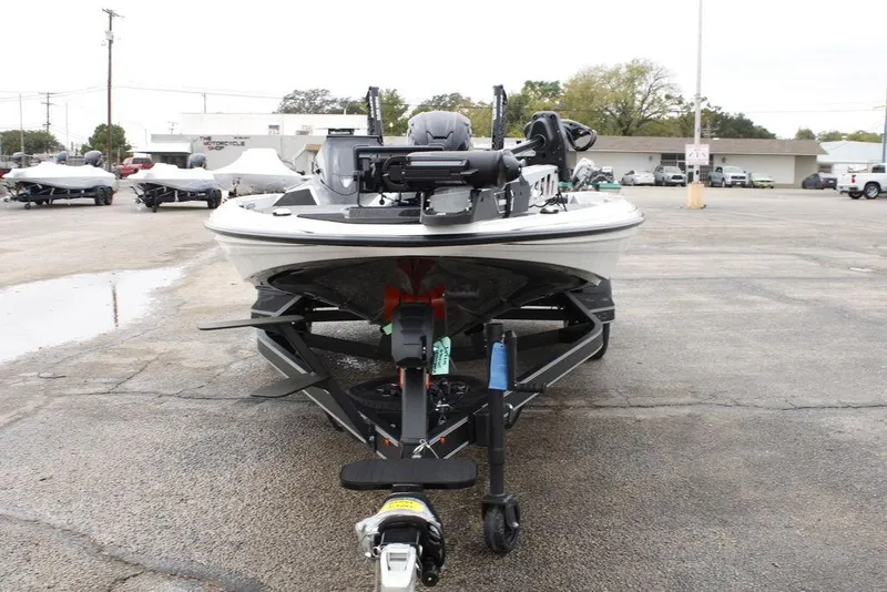 Slide: The Image of 2026 Skeeter ZXE21 boat on trailer in parking lot, front view. - 2