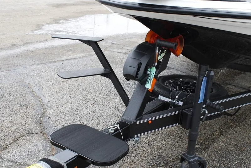 Slide: The Image of Trailer hitch of 2026 Skeeter ZXE21 boat on pavement. - 3