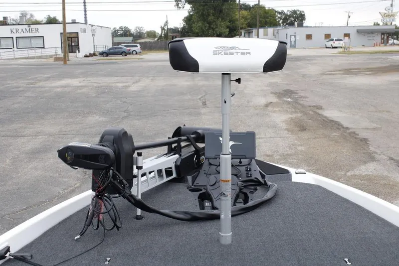 Slide: The Image of 2026 Skeeter ZXE21 boat with advanced trolling motor in a parking lot. - 8