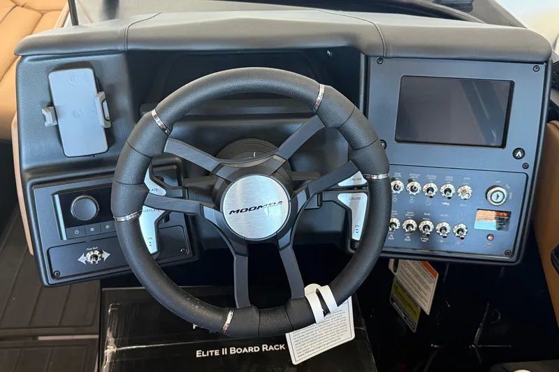 Slide: The Image of 2026 Moomba Max dashboard with steering wheel and control panel. - 15