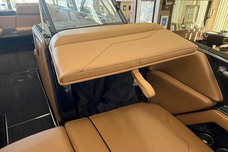 Slide: The Image of 2026 Moomba Max interior with tan leather seating and modern design. - 18