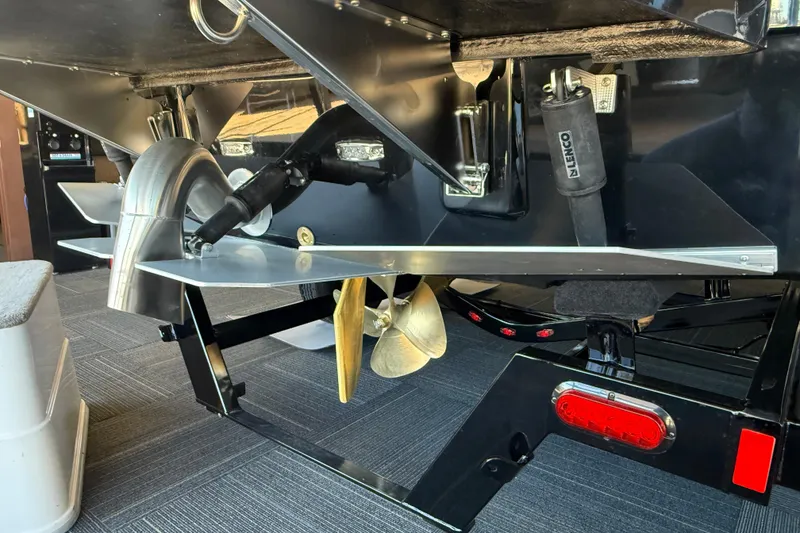 Slide: The Image of 2026 Moomba Max boat underside showing propeller and exhaust system. - 4