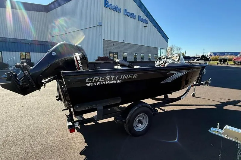 Slide: The Image of 2020 Crestliner 1650 Fish Hawk SE SC boat on trailer outside dealership. - 3