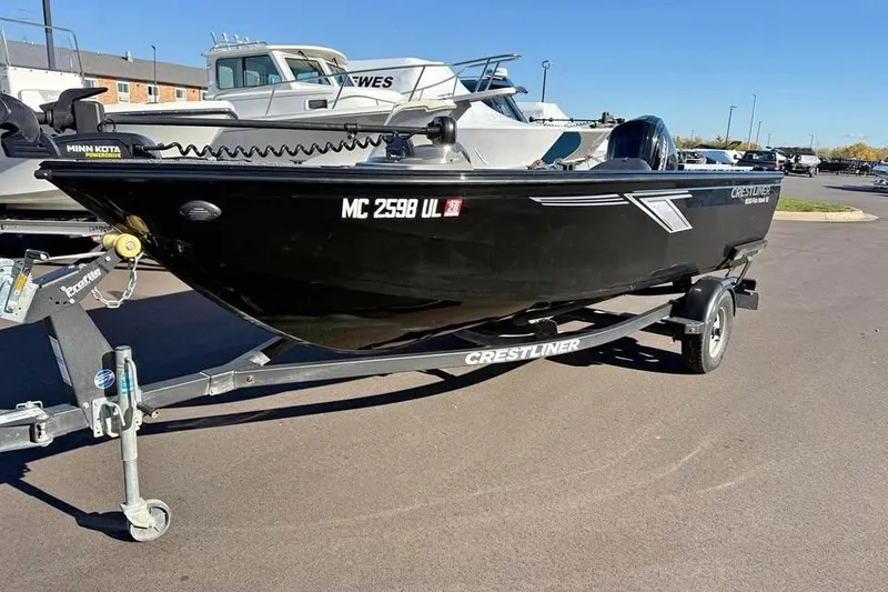 Slide: The Image of 2020 Crestliner 1650 Fish Hawk SE SC boat on trailer, parked outdoors. - 4