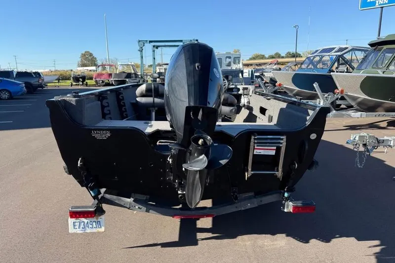 Slide: The Image of 2020 Crestliner 1650 Fish Hawk SE SC boat, rear view with outboard motor. - 5