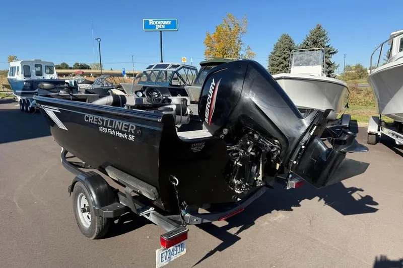 Slide: The Image of 2020 Crestliner 1650 Fish Hawk SE SC boat with Mercury outboard motor on trailer. - 6