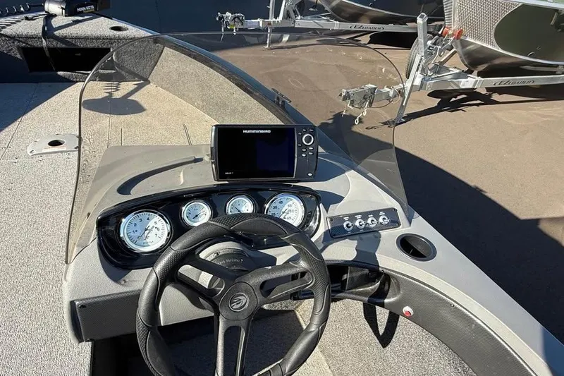 Slide: The Image of 2020 Crestliner 1650 Fish Hawk SE SC dashboard with steering wheel and gauges. - 9