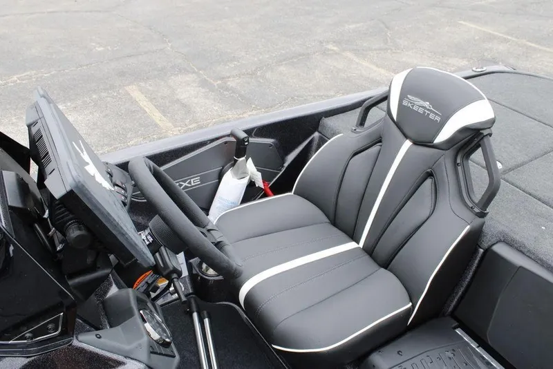 Slide: The Image of 2026 Skeeter ZXE20 boat interior with sleek black and white seating and modern controls. - 10