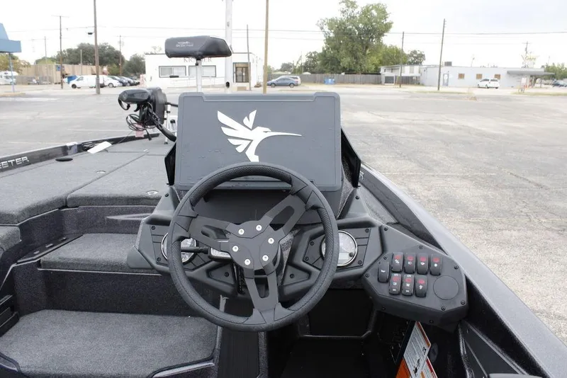 Slide: The Image of 2026 Skeeter ZXE20 boat dashboard with steering wheel and control panel. - 17