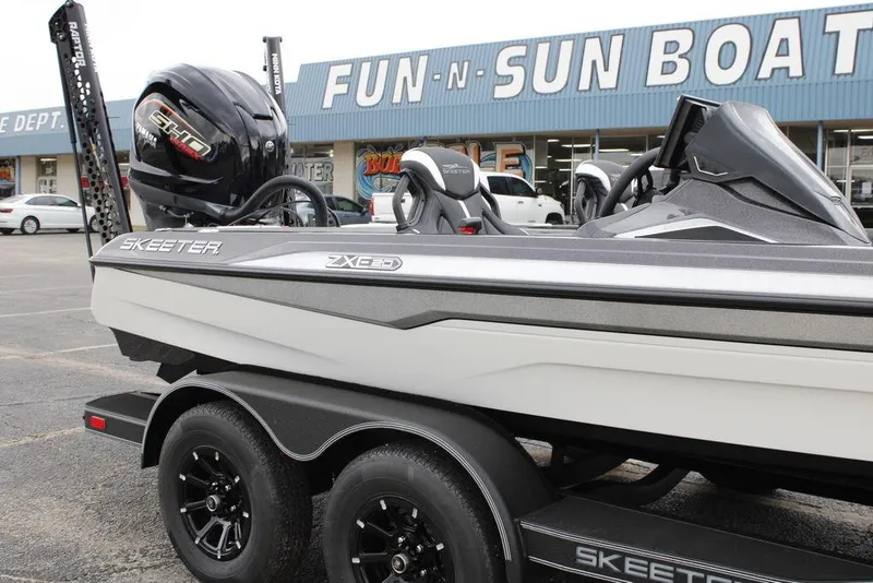 Slide: The Image of 2026 Skeeter ZXE20 boat on trailer outside Fun-N-Sun Boats dealership. - 2