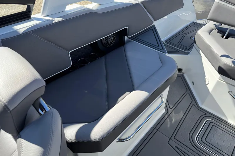 Slide: The Image of 2021 Cobalt R6 Surf boat interior with gray seating and modern design. - 12