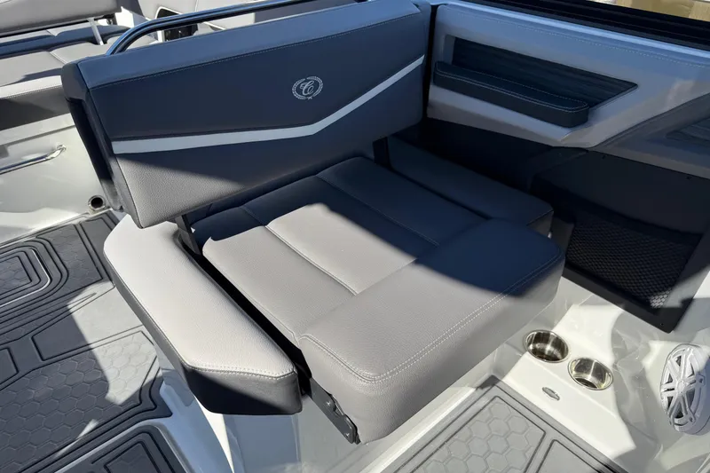 Slide: The Image of 2021 Cobalt R6 Surf boat interior with gray seating and cup holders. - 14