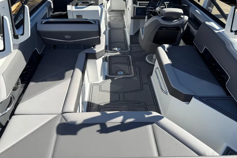 Slide: The Image of 2021 Cobalt R6 Surf boat interior with sleek seating and modern design. - 15