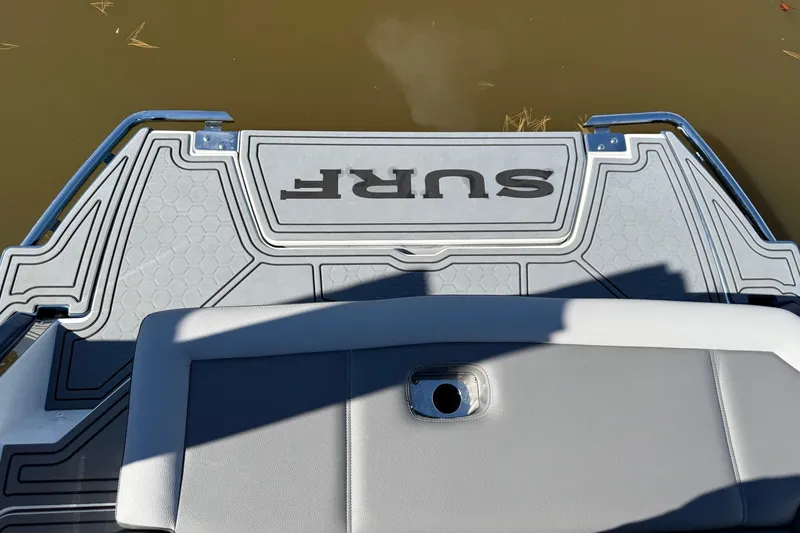 Slide: The Image of 2021 Cobalt R6 Surf boat platform with stylish design on calm water. - 5