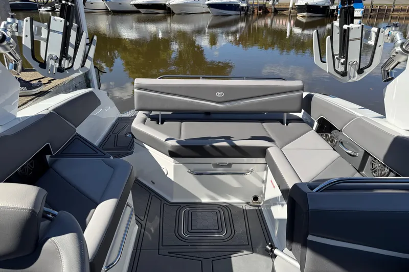 Slide: The Image of 2021 Cobalt R6 Surf boat interior with sleek gray seating and modern design. - 9