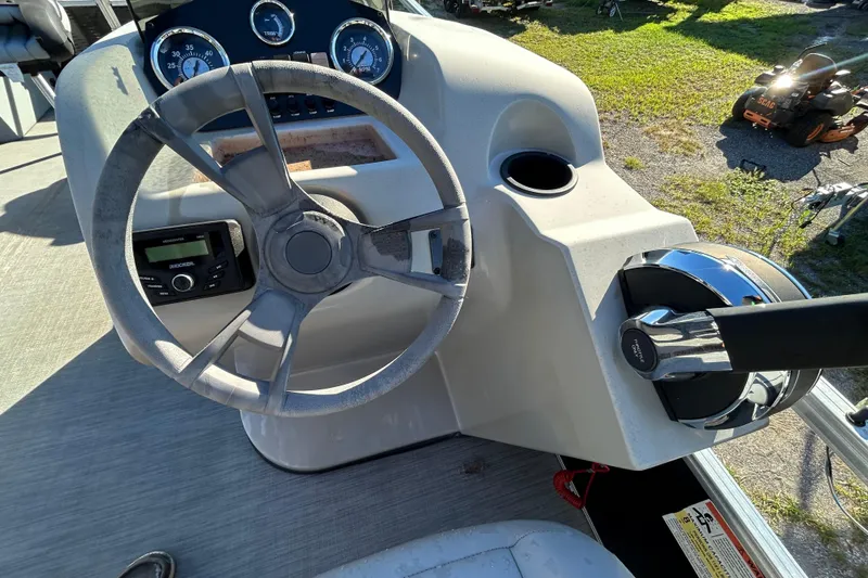 Slide: The Image of Steering console of 2023 Lowe Ultra 162 Fish & Cruise boat with gauges and controls. - 22