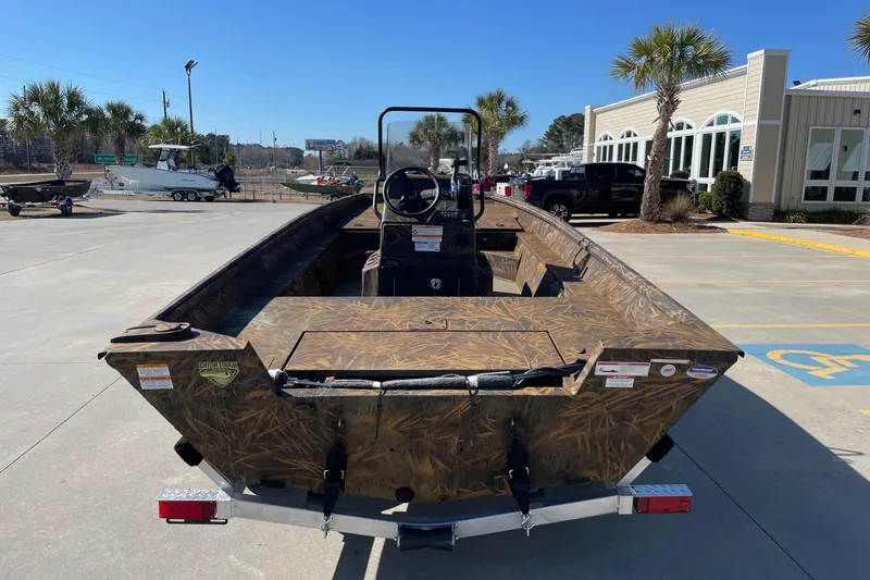 Slide: The Image of 2026 G3 17 CC Shadow Grass boat on trailer, parked outdoors near dealership. - 4