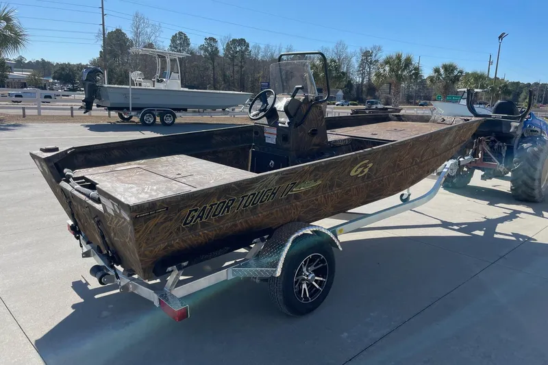 Slide: The Image of 2026 G3 17 CC Shadow Grass boat on trailer, parked outdoors. - 5