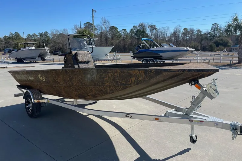Slide: The Image of 2026 G3 17 CC Shadow Grass boat on trailer in outdoor lot. - 7