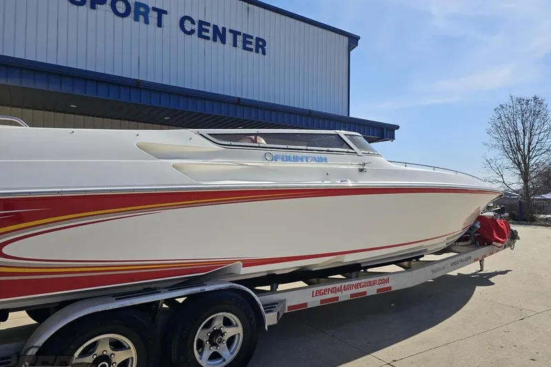 Slide: The Image of 2007 Fountain 35 Lightning boat on trailer outside sport center. - 11