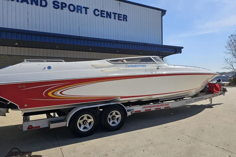 Slide: The Image of 2007 Fountain 35 Lightning boat on trailer outside sport center. - 12