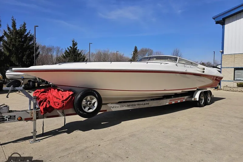 Slide: The Image of 2007 Fountain 35 Lightning speedboat on trailer, parked outdoors on a sunny day. - 18