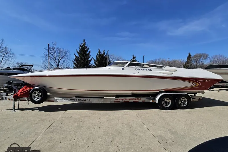 Slide: The Image of 2007 Fountain 35 Lightning speedboat on trailer under clear blue sky. - 21