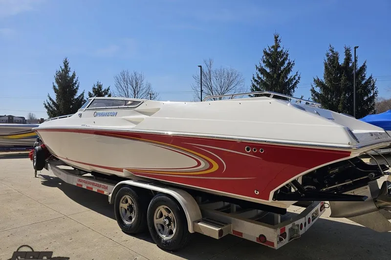 Slide: The Image of 2007 Fountain 35 Lightning speedboat on trailer, red and white design, parked outdoors. - 26