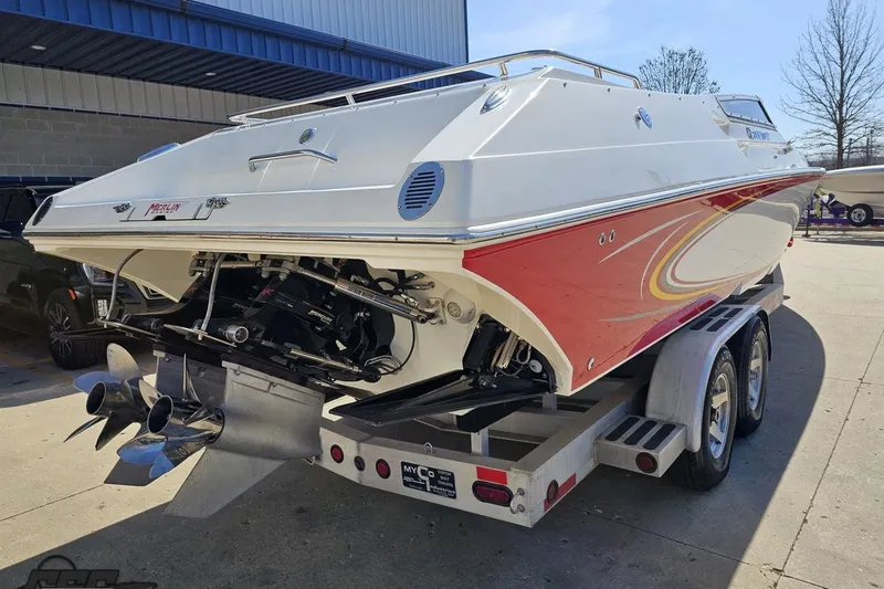 Slide: The Image of 2007 Fountain 35 Lightning boat on trailer, red and white design, parked outdoors. - 32