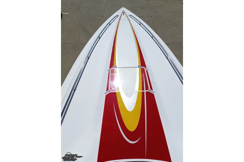 Slide: The Image of 2007 Fountain 35 Lightning boat with red and yellow design on deck. - 37