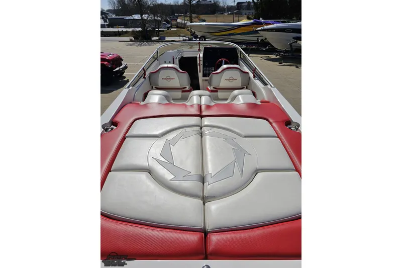 Slide: The Image of 2007 Fountain 35 Lightning boat interior with red and white seating, parked outdoors. - 41