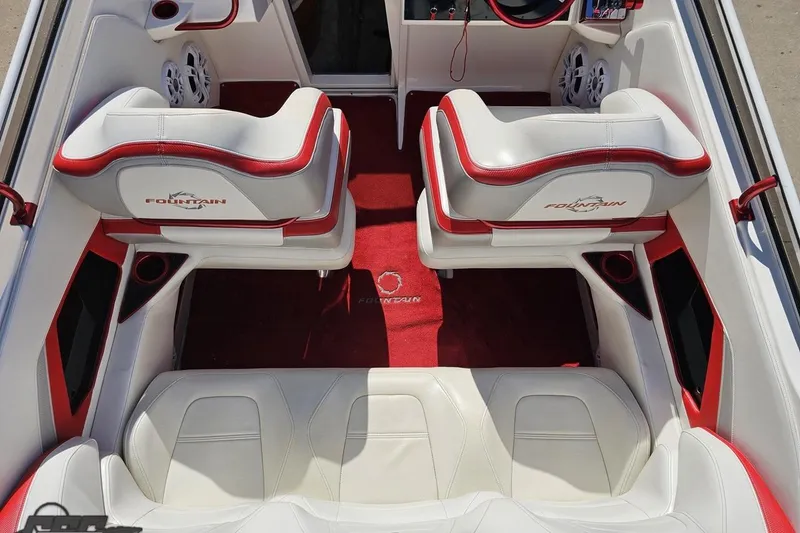 Slide: The Image of 2007 Fountain 35 Lightning boat interior with red and white seating and carpet. - 46