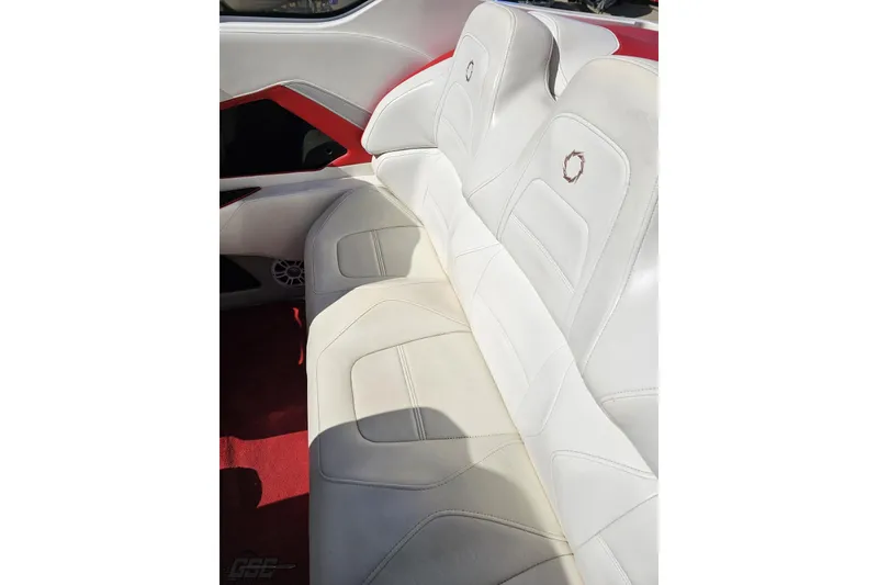 Slide: The Image of 2007 Fountain 35 Lightning boat interior with white leather seats and red accents. - 49