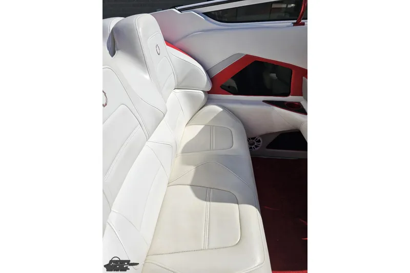 Slide: The Image of 2007 Fountain 35 Lightning boat interior with white leather seating and red accents. - 52