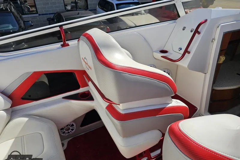 Slide: The Image of 2007 Fountain 35 Lightning boat interior with red and white seating and dashboard. - 54